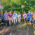 Students and community members pose in a field in Puerto Rico